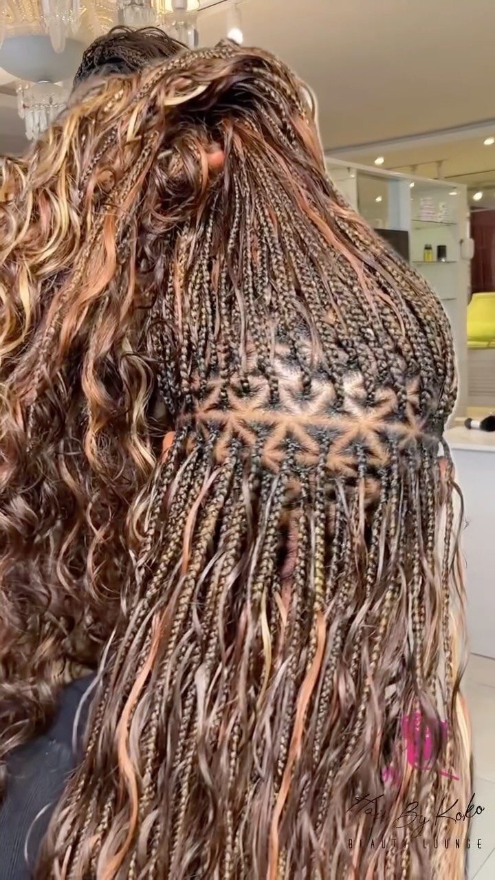 Long highlighted box braids show triangle-shaped parts at the crown