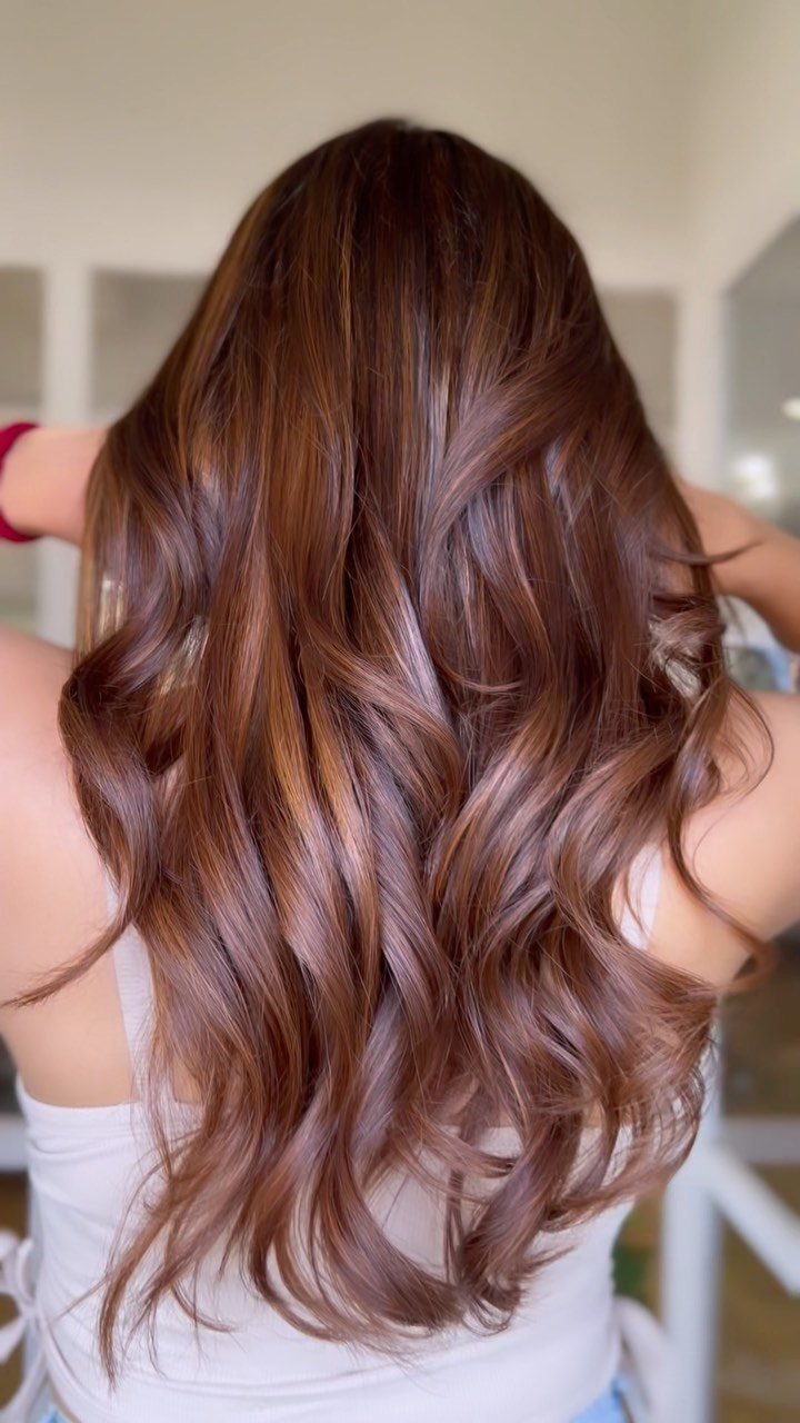 Long wavy chestnut-brown hair with fine, subtle lighter strands