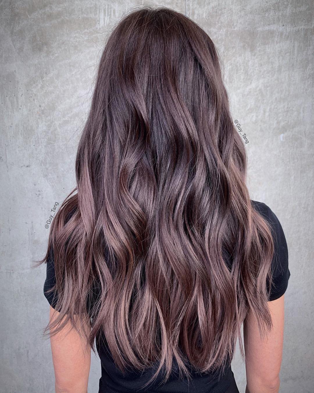 Long wavy dark brown hair with cool, silvery ash-brown dimension