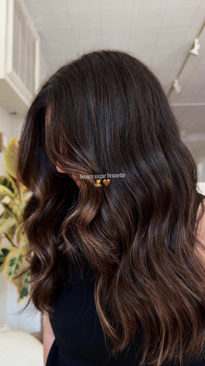 Long dark brown waves with subtle lighter brown accents