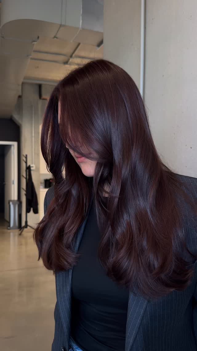 Long dark burgundy hair with a glossy red-violet sheen