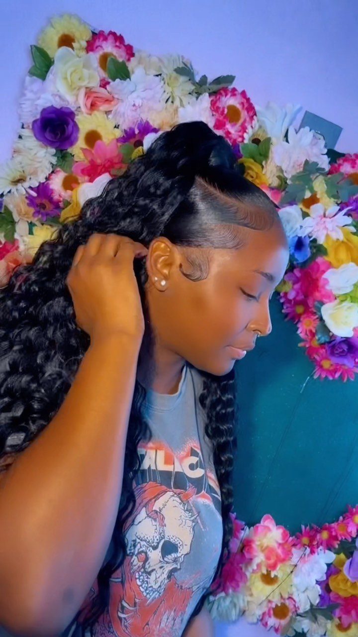 Woman showing long black curls in a high half-ponytail with blended edges