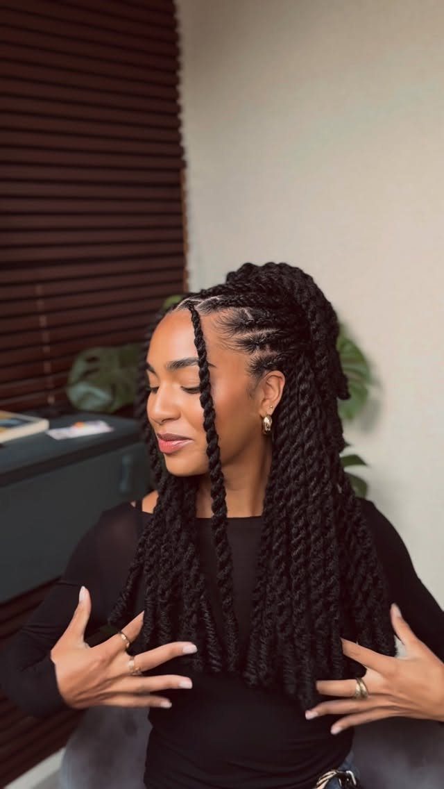 Woman showing long dark Marley twists with two face-framing strands