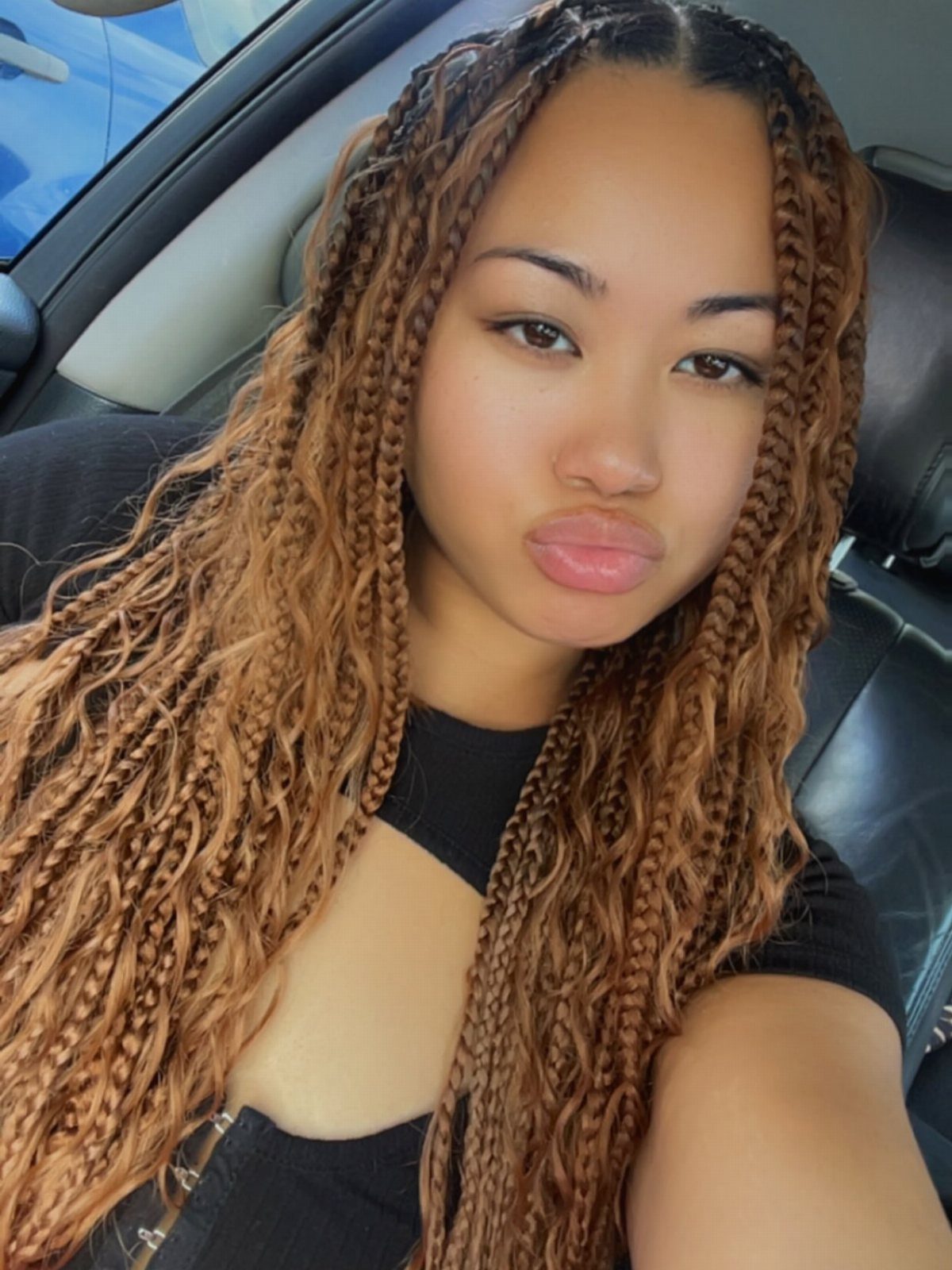 Long brown ombré braids with dark roots and warm caramel lengths
