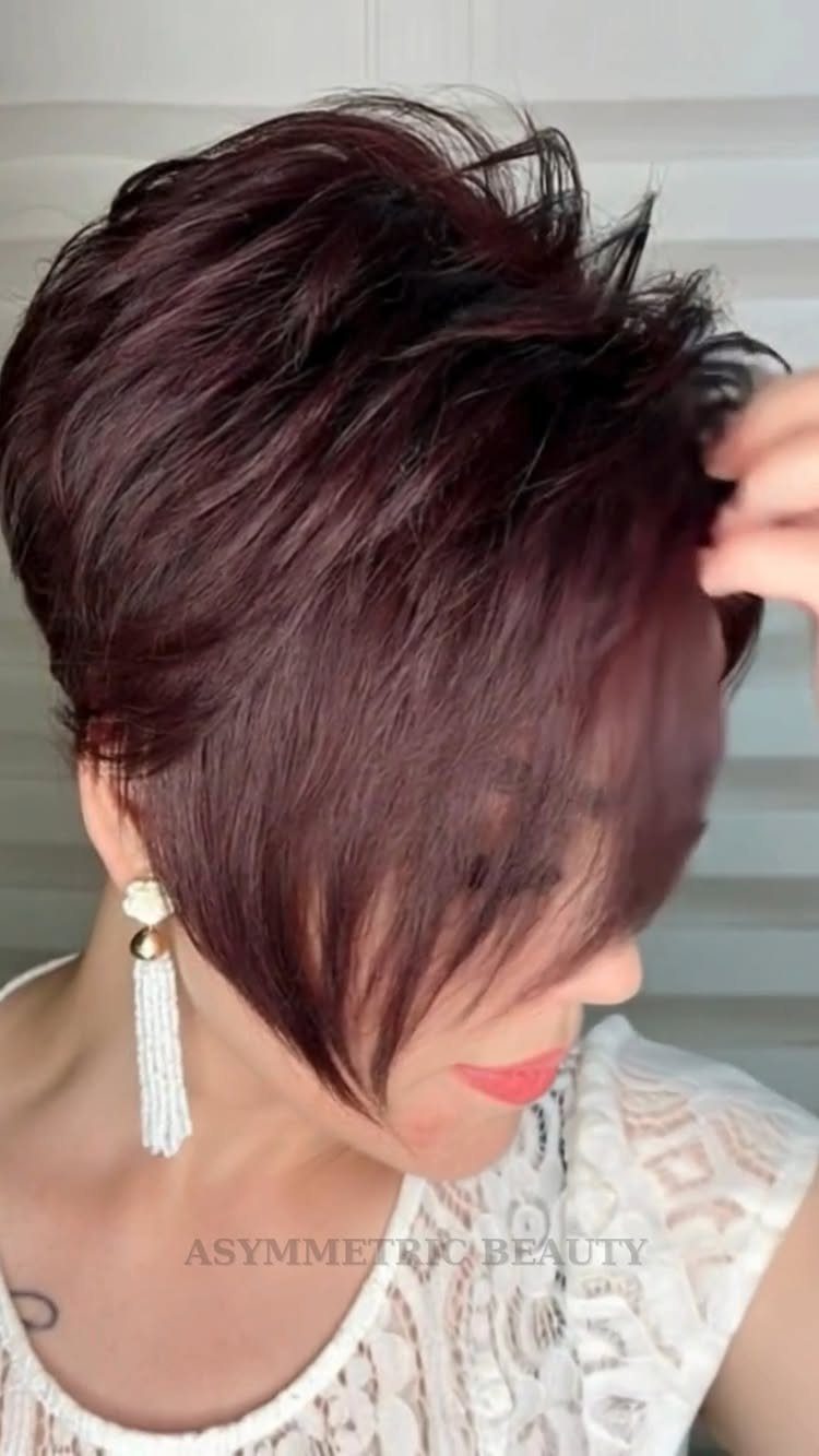 Short asymmetrical bob with longer face-framing pieces and tousled dark hair